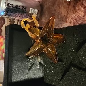 Vintage glass amber star9ornament in velvet boxes new..has star cut in middle.